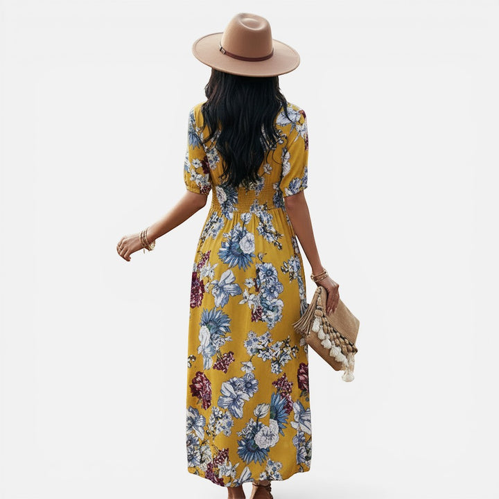 Laurior | Robe d'été légère pour femme, idéale pour les vacances, vue arrière avec motif floral en jaune.