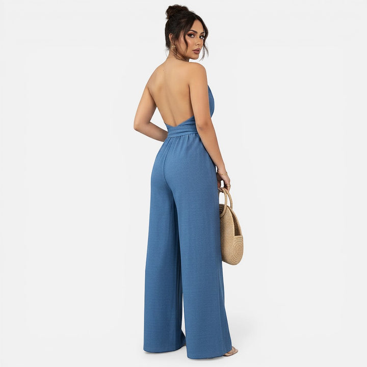 Laurior | Combinaison habillée dos nu pour femme, coupe large, vue arrière en bleu avec une silhouette fluide.