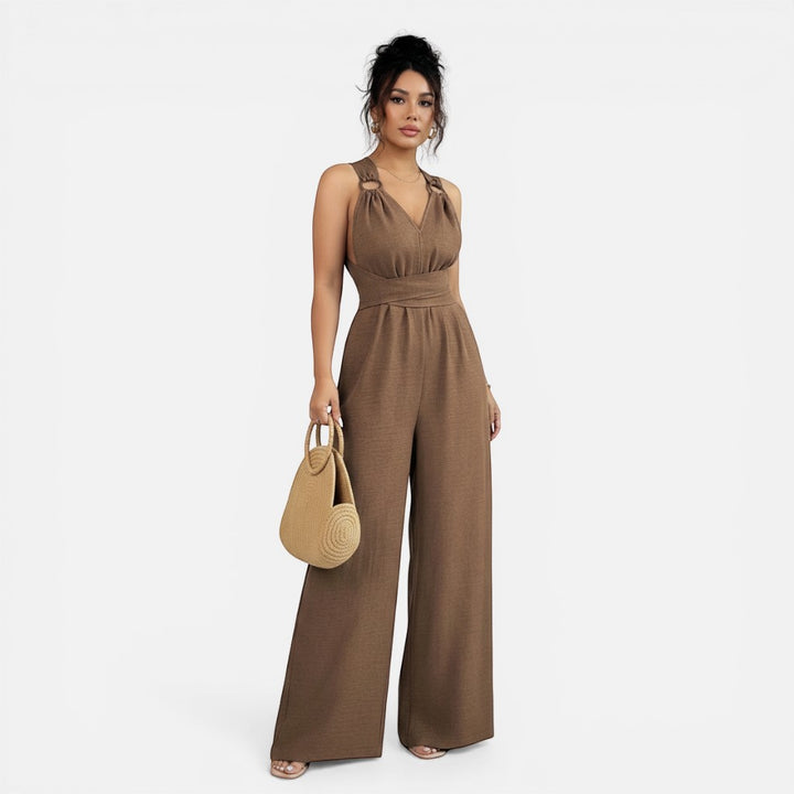 Laurior | Combinaison habillée dos nu pour femme, coupe large portée par modèle avec sac.