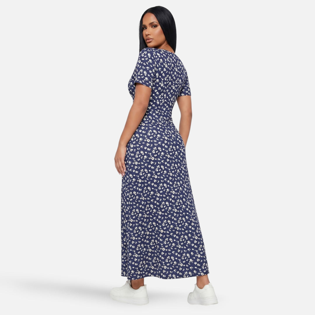 Laurior | Robe longue portefeuille fleurie silhouette empire pour femme vue de dos avec un motif floral.