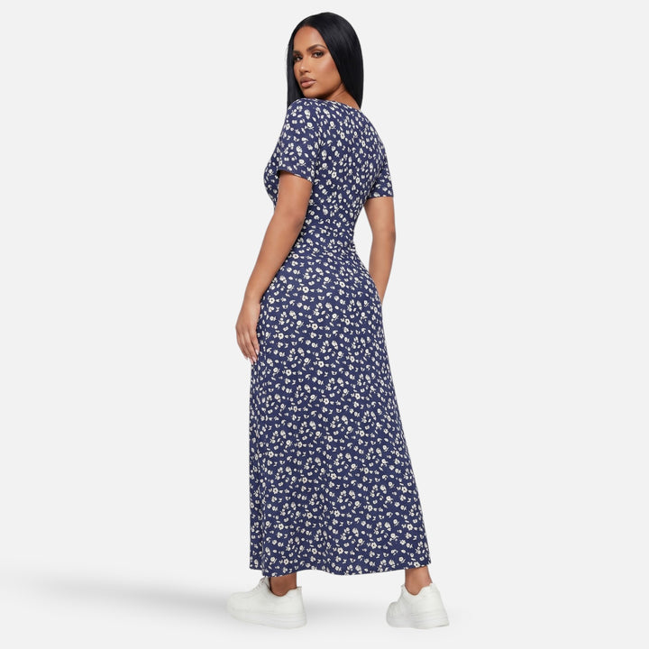 Laurior | Robe longue portefeuille fleurie silhouette empire pour femme vue de dos avec un motif floral.