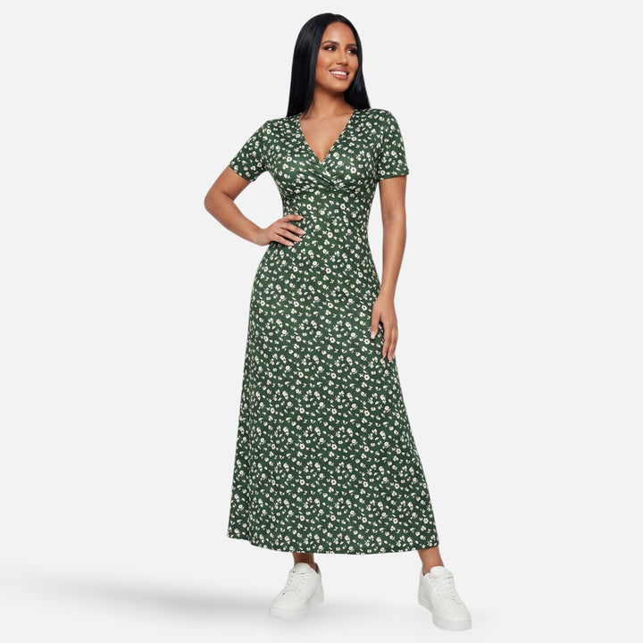 Laurior | Robe longue portefeuille fleurie silhouette empire pour femme portée par une femme, élégance florale.