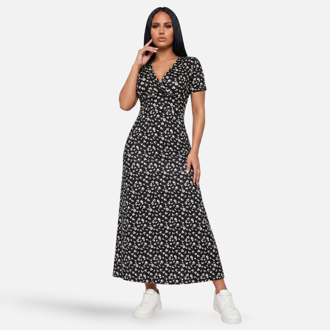 Laurior | Robe longue portefeuille fleurie silhouette empire pour femme en noir avec motifs floraux.